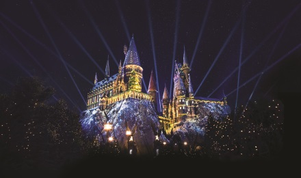 Fireworks at night outside the castle of the Wizarding World of Harry Potter at Universal Orlando