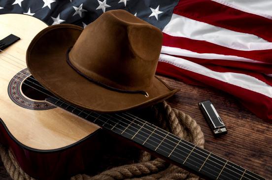 image of guitar, hat and American flag