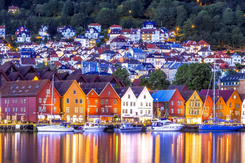 Reflection of houses and boats on water