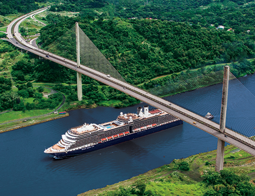 image of HAL cruise ship on Panama Canal going under a bridge