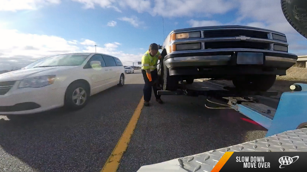 image of roadside service assisting in a broken down vehicle