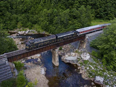 image of train going across bridge