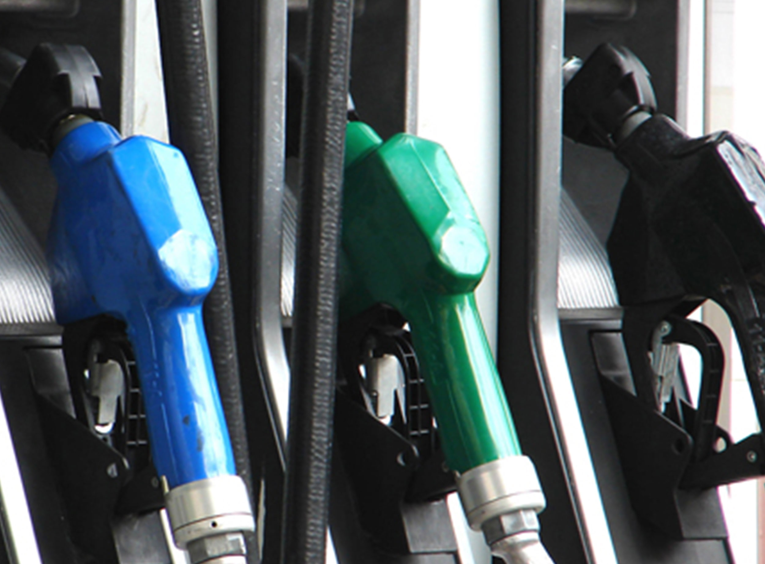 image of blue, green and black gas pumps