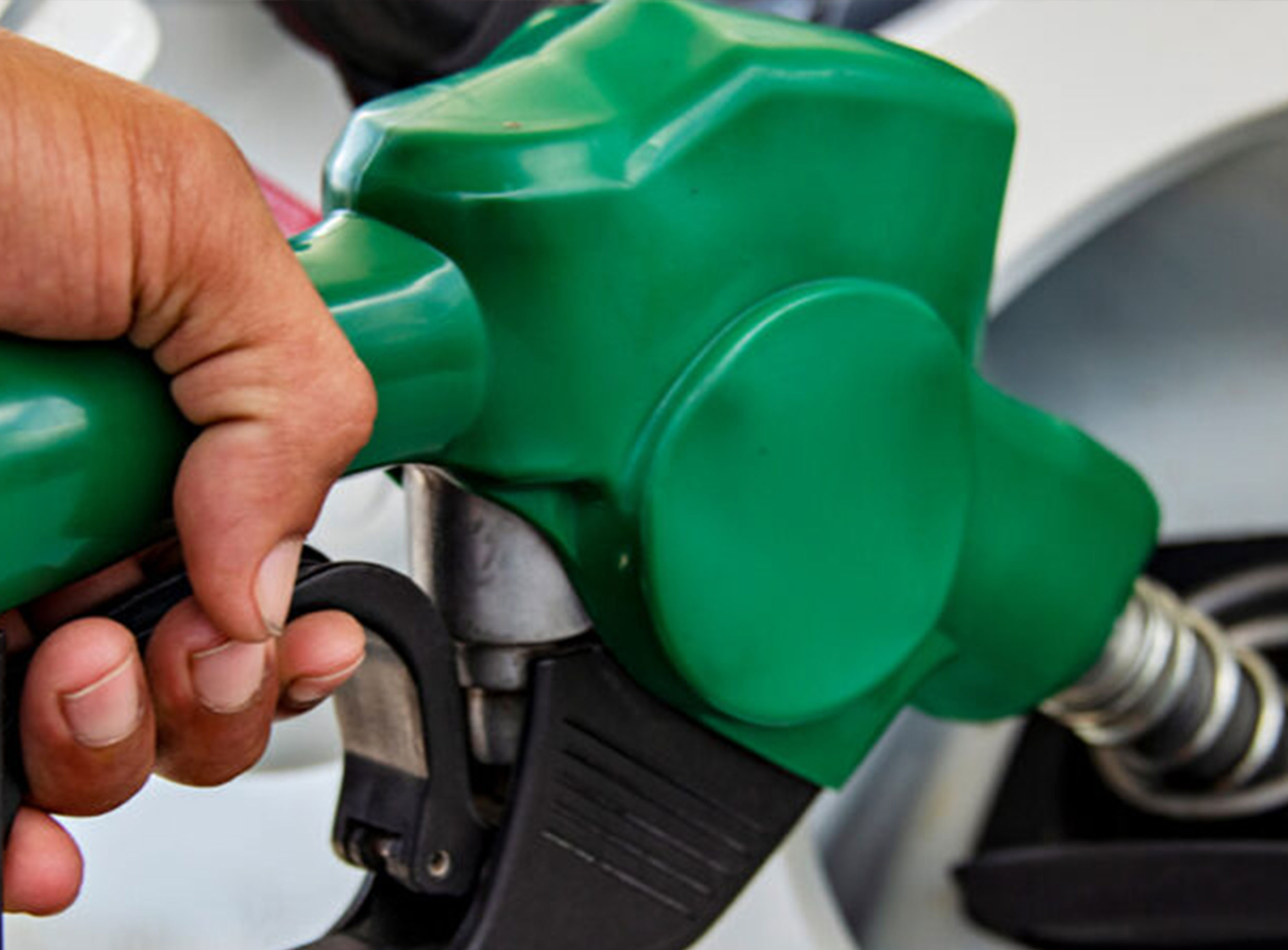image of man filling vehicle with gas