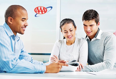 Insurance Agent sitting with a couple discussion bundling their home and Auto Insurance