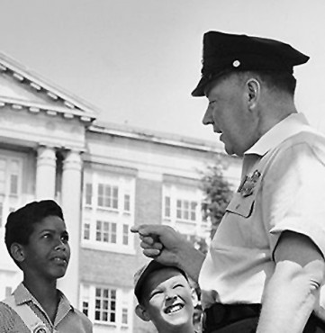 officer speaking with children