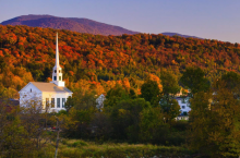 image of Vermont church surrounded by colorful Fall trees