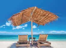 image of lounge chairs on the beach